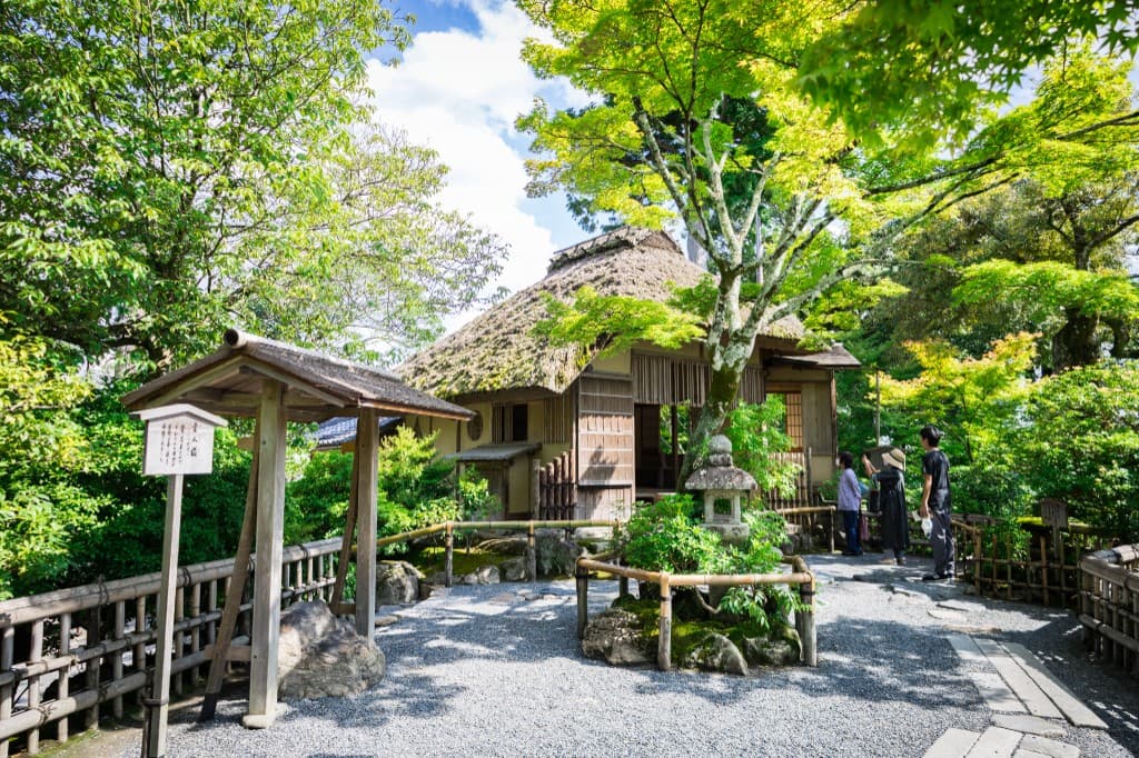 Traditional thatched tea house in a Japanese garden
